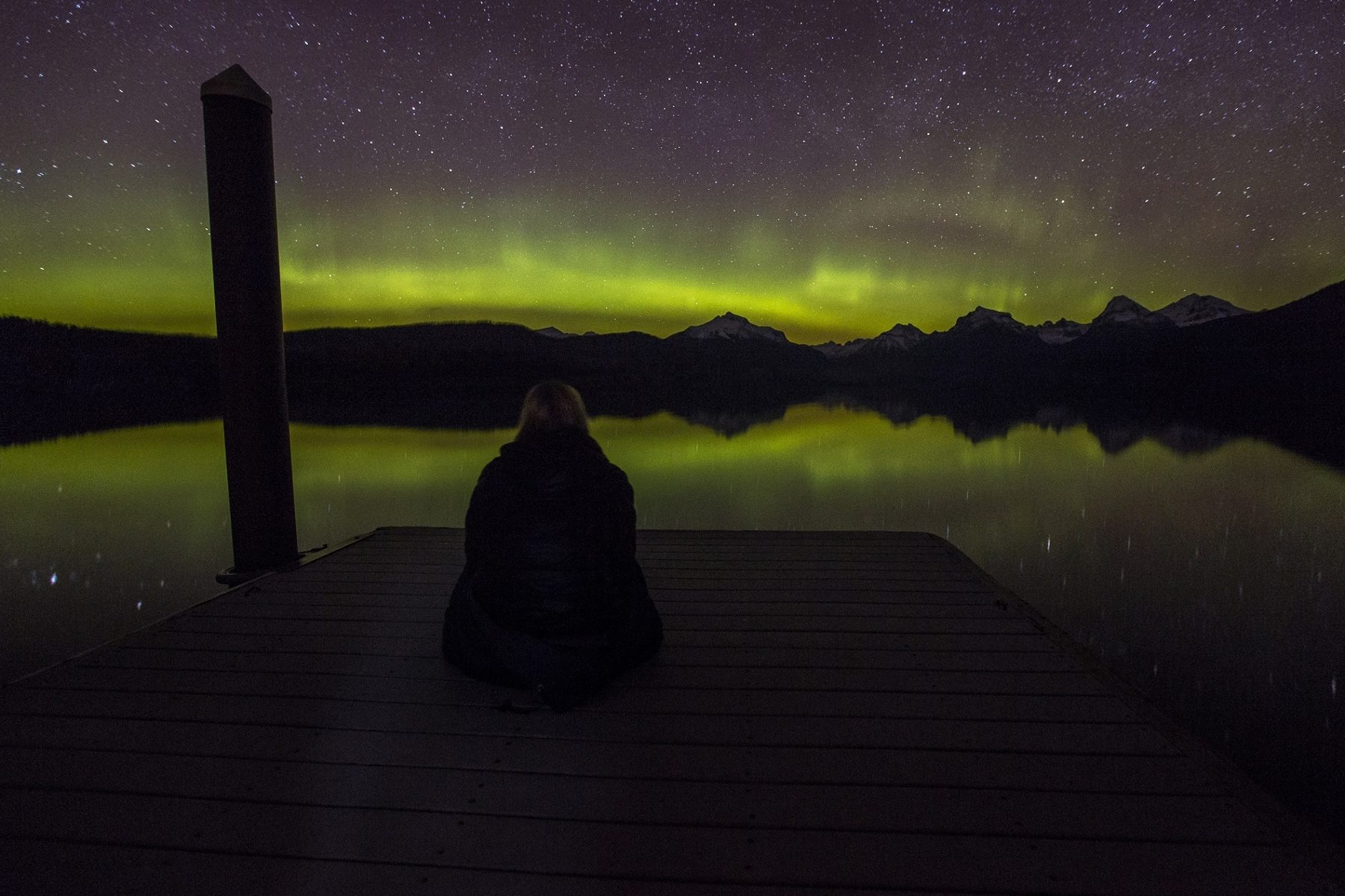 Aurora over a mountain lake