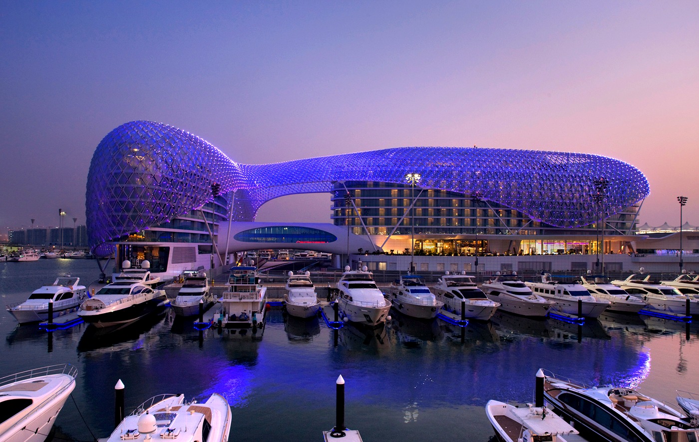 Yas Marina Hotel bridging the marina, Abu Dhabi, at dusk